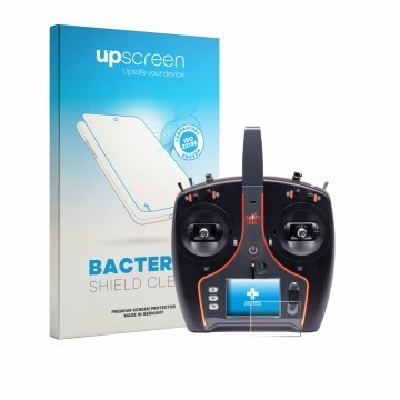 Front side of a product packaging with the brand logo upscreen. Next to it is the device Spektrum NX7e Plus shown with the cor